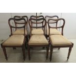 A set of six early Victorian rosewood framed balloon back dining chairs, the watered mushroom