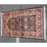 A Kelim part silk prayer rug, decorated with floral designs, on a multi-coloured ground with a