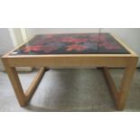 A (probably) 1980s coffee table, the foliate decorated, painted laminate steel drop-in tile effect