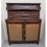 A Regency goncalo alves chiffoniere with bead carved borders, the shelved upper part over a pair