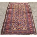 A Bokhara rug with elephant foot pattern motifs, on a blue and red ground  72" x 40"