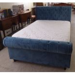 An aqua blue suede fabric covered double bed frame, the headboard 58"w with a Cashmere mattress