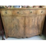 A mid 20thC Hobbs & Co Regency design mahogany bowfront sideboard with three drawers and two