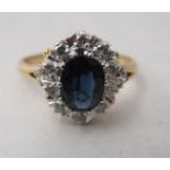 An 18ct gold claw set sapphire and diamond ring