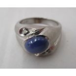 A 10ct textured white gold dress ring, set with a star sapphire and diamond