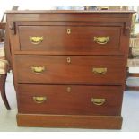 A late 19thC mahogany dressing chest, featuring a brushing slide, over a three long drawers with