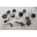 Five various pairs of pendant earrings: to include an example set with green stones and seed pearls