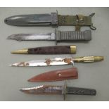 Three various hunting knives: to include a commando type, in a sheath  the blade 6"L