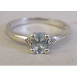 A 9ct white gold aquamarine and diamond set ring