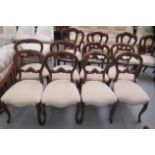 A set of four late 19thC carved walnut framed balloon back chairs, the serpentine front seats