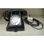 A mid 20thC black Bakelite cased telephone handset with a cradle type receiver, address drawer and