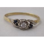 An 18ct gold sapphire and diamond set crossover ring