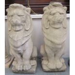 A pair of composition stone heraldic lions with shields  34"h