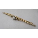 A 15ct gold diamond set bar brooch