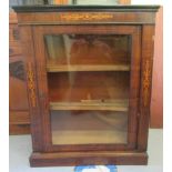 A late Victorian rosewood and marquetry pier cabinet, enclosed by a glazed panelled door, on a