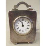An Asprey & Co traveller's miniature timepiece, the silver case of rectangular box design with a