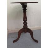 An early 20thC mahogany pedestal table, on a bobbin turned column, raised on a tripod base  28.5"