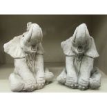 A pair of composition stone terrace ornaments, seated baby elephants  10"h