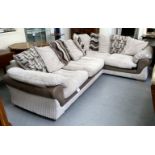 A DFS corner settee with four textured cream coloured fabric cushioned seats, raised on block