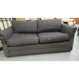 A Wesley-Barrell two person box settee, upholstered in charcoal coloured fabric with a cushioned