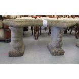 A composition stone garden seat, the curved top upon two squirrel pedestals  17"h  38"w
