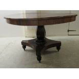 A William IV rosewood veneered centre table, raised on a bulbous octagonal pedestals and a splayed