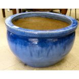 A streaky glazed pottery planter  12.5"h  20"dia
