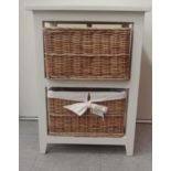 A modern white painted cupboard with two woven cane drawers, raised on block feet  26"h  19"w