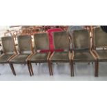 A set of six teak framed G-Plan dining chairs, the fabric covered backs and seats raised on