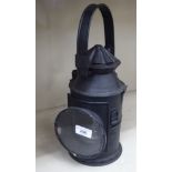 A reproduction of a black painted iron railway signal lamp  12"h