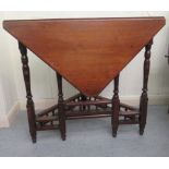 An Edwardian mahogany single drop leaf occasional table of triangular form, raised on ring turned