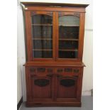 A late 19th/early 20thC Arts & Crafts inspired mahogany cabinet bookcase, the upperpart with a