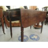 A George III mahogany Pembroke table, raised on ring turned, tapered legs  27"h  36"w