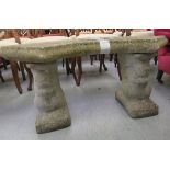 A composition stone garden seat, the curved top upon two squirrel pedestals  17"h  38"w