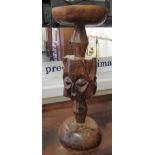 An African native carved stand, incorporating conjoined masks  21"h