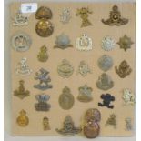 Thirty regimental cap badges and other insignia, some copies: to include Tyneside Scottish, 3rd