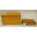 An early 20thC birdseye maple veneered casket with straight sides and a lockable hinged lid,