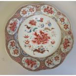 An 18thC Chinese porcelain wavy edged charger, decorated in famille rose with floral designs and