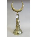 An early 20thC Islamic brass Alem (pole top) later mounted on a broad, domed base  19.5"h overall