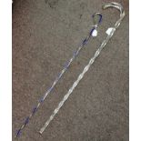 A solid clear glass spiral moulded frigger stick with a crook handle  36"L; and another of similar