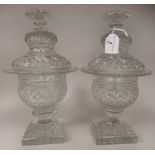 A pair of 19thC glass pedestal sweet jars and covers with finely hobnail cut, fan and other ornament