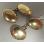 A pair of 15ct gold oval tablet and chain cufflinks