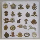 Twenty-five regimental cap badges and other insignia, some copies: to include 7th Dragoon guards,