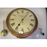 A late 19thC mahogany cased drop-dial wall timepiece with a turned surround; the single fusee
