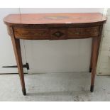 An early 19thC overpainted, ebony string inlaid and crossbanded demi-lune card table, the foldover