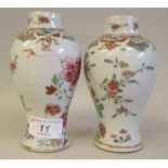 A pair of late 19thC Chinese porcelain vases of waisted baluster form, decorated in famille rose and