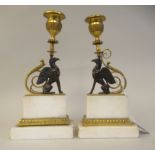 A pair of Empire period white marble and gilt metal and bronze sidepiece candlesticks, each