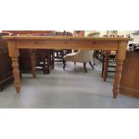 A modern pine refectory table, the one piece top with rounded corners, raised on tapered legs  31"h