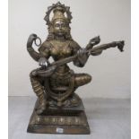 A 20thC Asian patinated bi-coloured bronze Buddhist goddess with four arms, seated cross-legged,