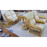 Conservatory furniture: to include a caned framed three piece suite with floral patterned fabric